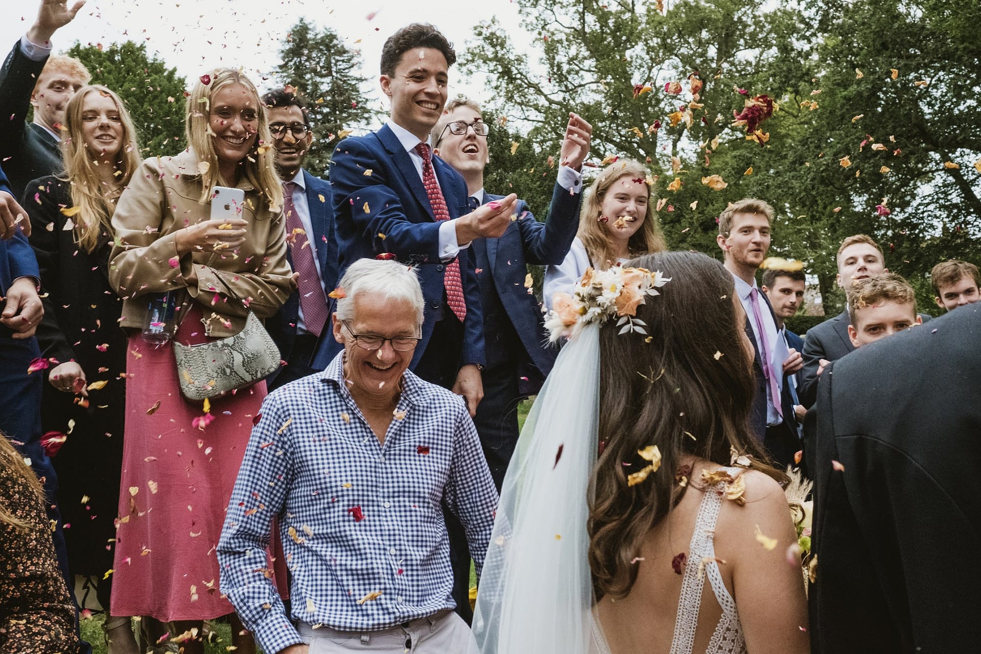 bride and groom confetti guests all throwing