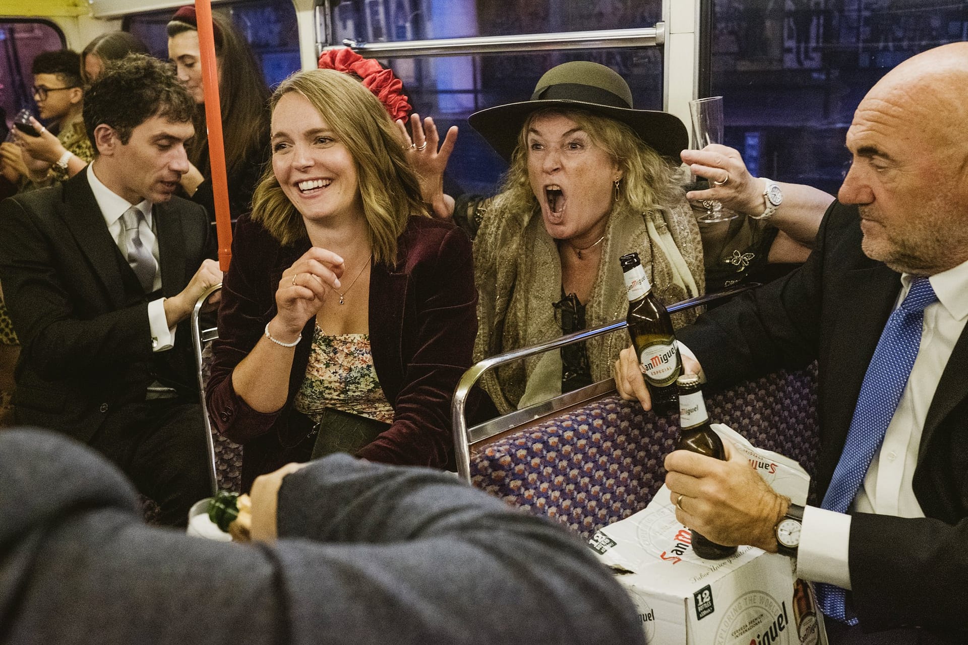 wedding guests on the london bus