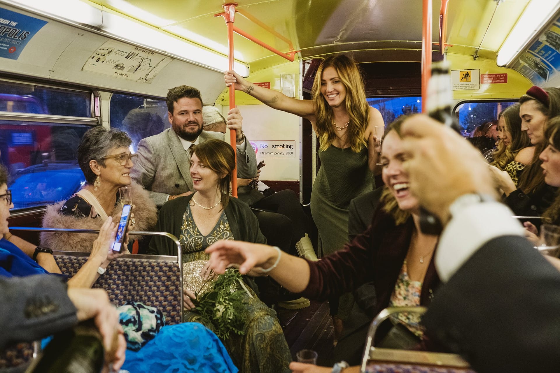wedding guests on the london bus