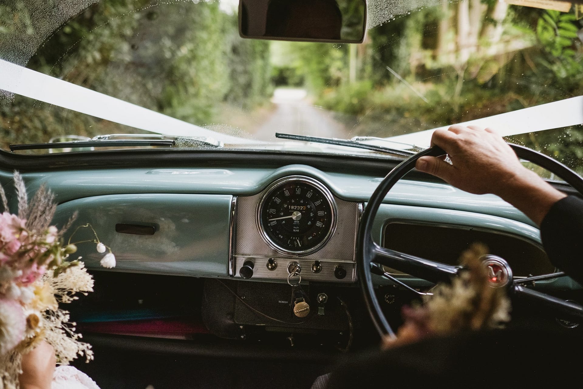photographer shooting in the wedding car