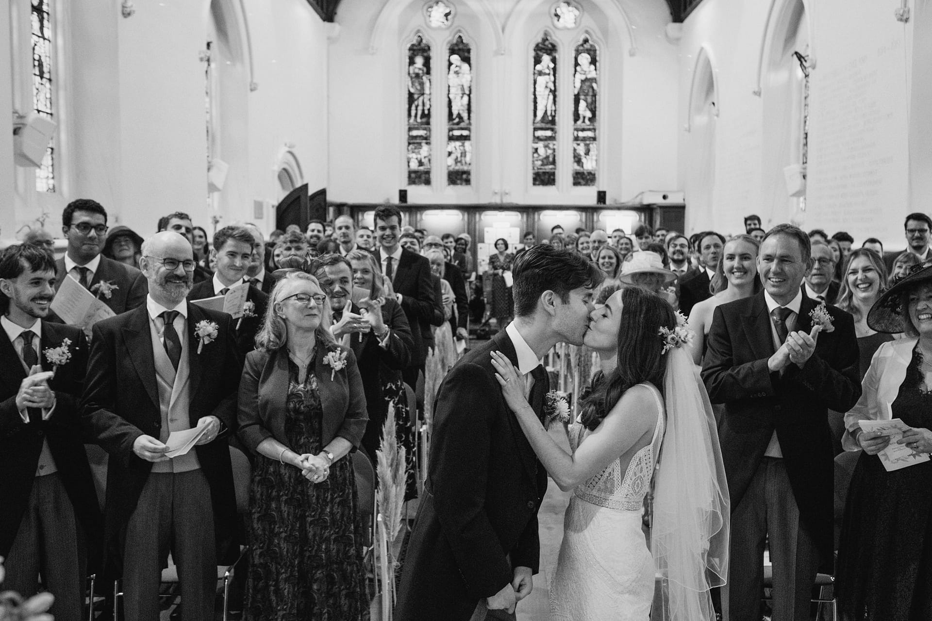 bride and groom first kiss during the ceremony