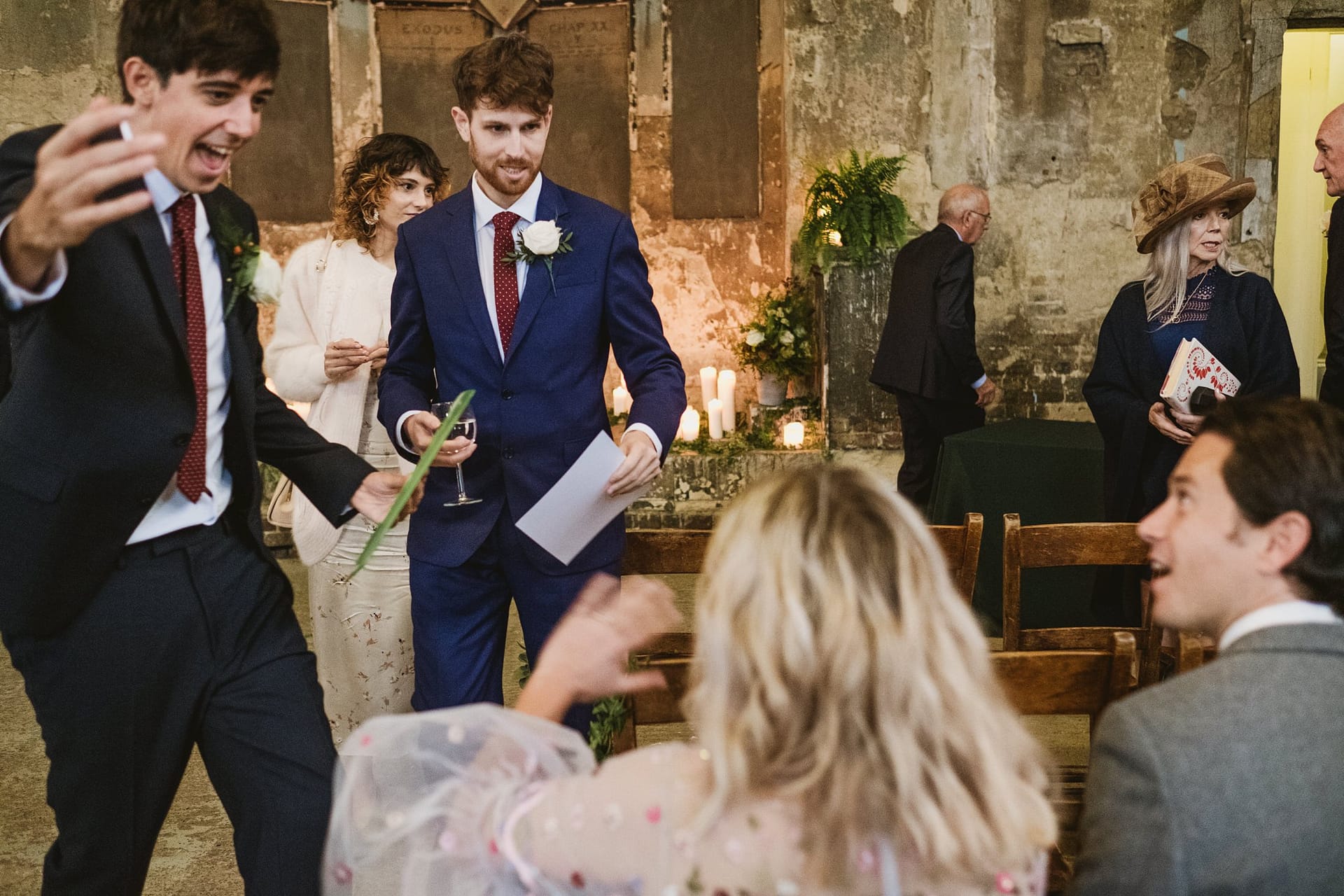 groom talking to wedding guests at the asylum chapel