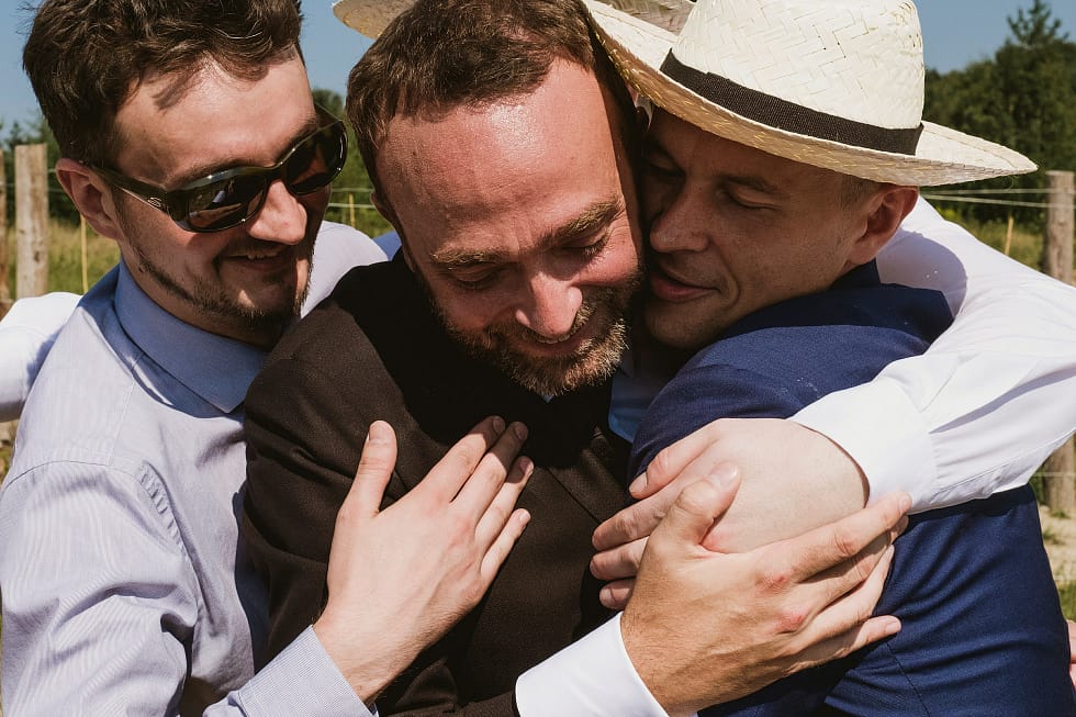 Men hugging at Krakow wedding